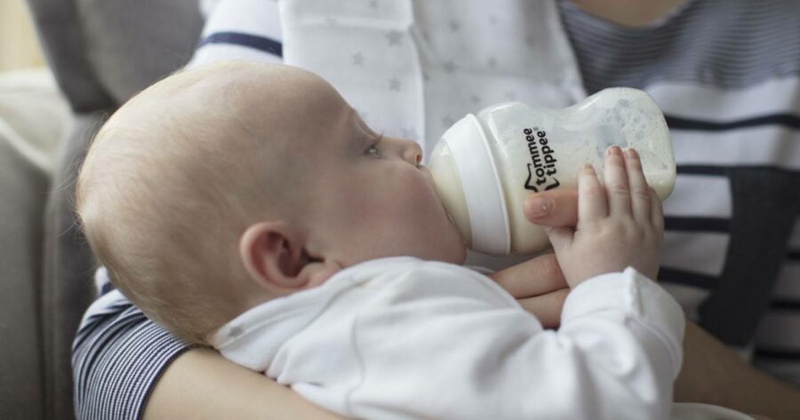 baby feeding from tommee tippee closer to nature bottle