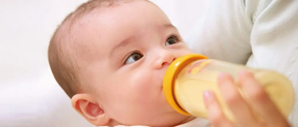 baby-drinking-from-pigeon-feeding-bottle-1024x439